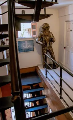 a man in an astronaut suit standing on a staircase at Loft with view 7 rooms in Cartagena de Indias