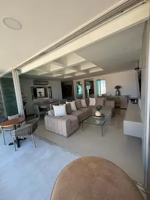 a living room with a couch and a table at Apto moderno frente CC Buenavista, lujo y vistas in Barranquilla