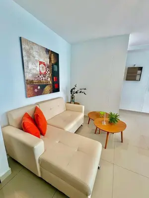 a living room with a couch and a table at Apartamento 1 dormitorio Morros. Vista Mar y Salida Playa in Cartagena de Indias