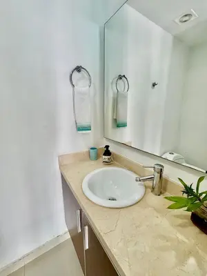 a bathroom with a sink and a mirror at Apartamento 1 dormitorio Morros. Vista Mar y Salida Playa in Cartagena de Indias