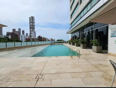 a swimming pool on the side of a building at Apartamento en el Hotel Estelar in Barranquilla