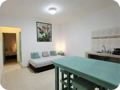 a living room with a couch and a table at Apartamentos Santori in Cartagena de Indias