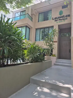 a building with plants in front of it at Laureles del parque loft in Barranquilla