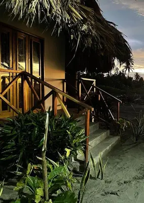 a house with stairs leading to a door and a porch at Casa Origen Boutique en San Bernardo del Viento in San Bernardo del Viento