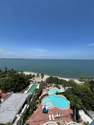 an aerial view of a resort with a swimming pool and the beach at Unwind in Santa Martas Oceanfront Retreat in Playa Dormida