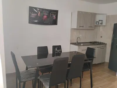 a kitchen and dining room with a table and chairs at Safariplaya in Cartagena de Indias