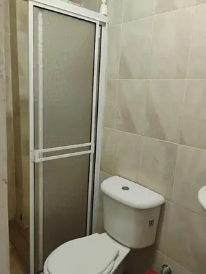 a bathroom with a toilet and a shower at Safariplaya in Cartagena de Indias