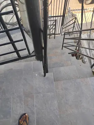 a pair of shoes sitting on the ground next to a staircase at Safarihostal in Cartagena de Indias