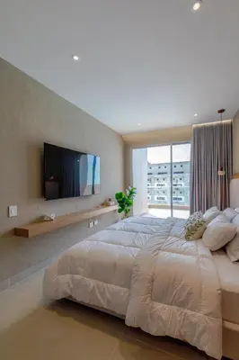 a large bedroom with a large bed and a tv at Palmar del Mar in Cartagena de Indias