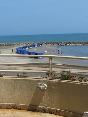 a view of a beach with a fence and the ocean at cartagena balcon con vista al mar in Cartagena de Indias