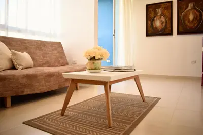 a living room with a coffee table and a couch at Luxury apartment with pool in Barranquilla