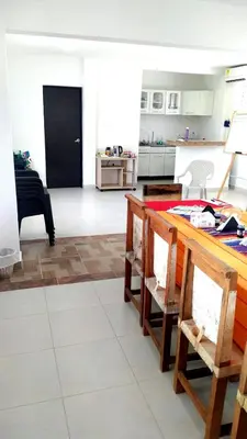 a kitchen with a counter and a table in a room at Casa Campestre Rancho 75 Eco Park in Arjona