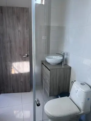 a bathroom with a toilet and a sink at Villa Matthew - Villa de Lujo con Piscina Privada y BBQ, Cerca al Mar in Juan de Acosta