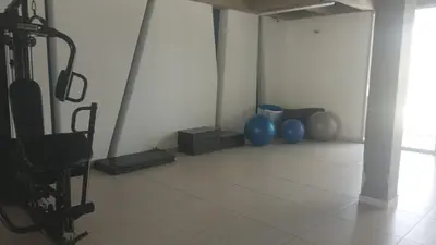 a room with two blue vases on a tile floor at Luxury apartment - Barranquilla 10 minutes to Buenavista in Barranquilla
