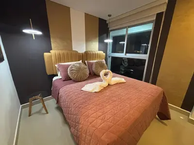 a bedroom with a bed with a stuffed animal on it at Apartamento Magno Loft Bocagrande in Cartagena de Indias