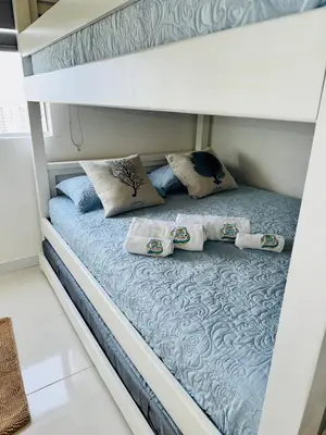 a bunk bed in a room with pillows on it at TorrePRIMI1905 in Cartagena de Indias