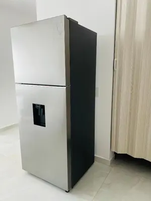 a white refrigerator with a black door in a room at Apartamento Marbella Piso 28 - Playa in Cartagena de Indias