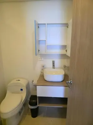 a bathroom with a white toilet and a sink at Cartagena Beach Exclusive apto in Cartagena de Indias