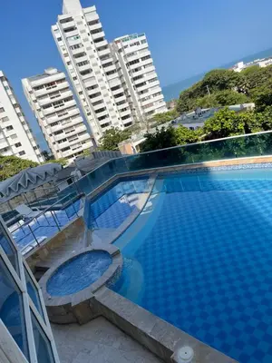 a swimming pool in front of some tall buildings at Apartamento a 1 minuto de la playa in Cartagena de Indias