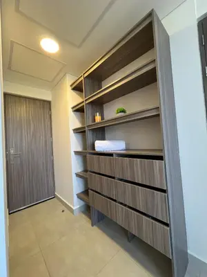 a walk in closet with wooden shelves and a door at cartagena apto castelo serena del mar in Puerto Tierrabaja