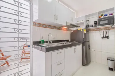 a kitchen with a sink and a refrigerator at Apartamento comodo con excelente ubicacion in Cartagena de Indias