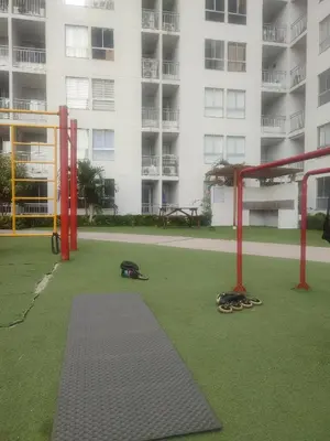 an empty playground in front of a large building at Piso apartamento Cartagena de indias in Cartagena de Indias