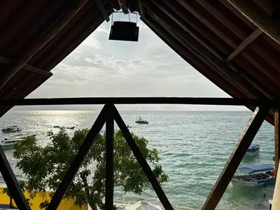 a view of the ocean from a window at La playita ocean view in Playa Blanca