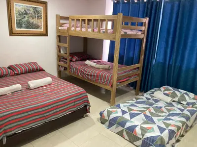 a bedroom with two bunk beds and a bed at Turipaná 209 in Cartagena de Indias