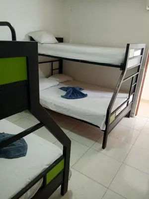 a room with two bunk beds in a room at Hotel Prado Cartagena in Cartagena de Indias