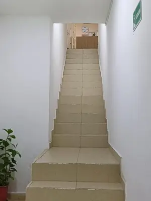 a stairway leading up to a building with white walls at Hotel Prado Cartagena in Cartagena de Indias