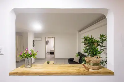 a living room with a table and plants at Cozy apartment in bocagrande in Cartagena de Indias