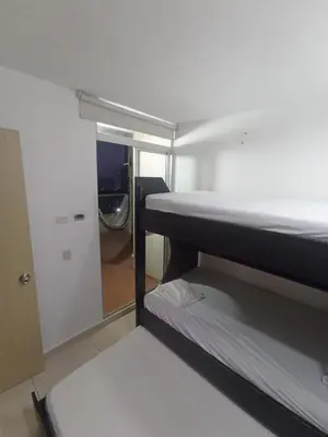 a room with two bunk beds and a mirror at Aqualina 911 in Cartagena de Indias