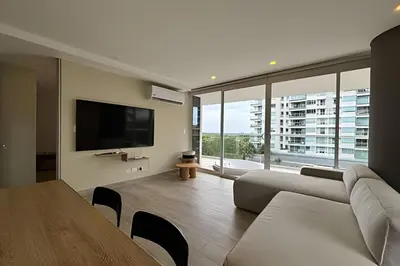 a living room with a couch and a flat screen tv at Dominique in Cartagena de Indias