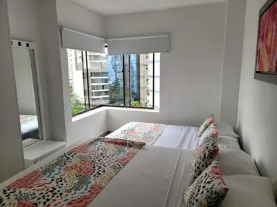 a bedroom with a bed and a large window at Live Stay - Cartagena Escape Plaza in Cartagena de Indias