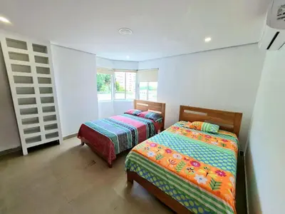 a bedroom with two beds and a window at Apartamento con la mejor vista Cartagena in Cartagena de Indias