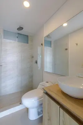 a bathroom with a white toilet and a sink at Cartagena Bella Por Días in Cartagena de Indias