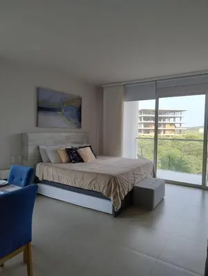 a bedroom with a large bed and a large window at Morros Manzanillo 324 in Cartagena de Indias