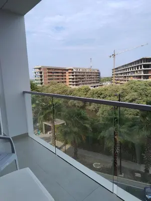 a balcony with a view of palm trees and buildings at Morros Manzanillo 324 in Cartagena de Indias