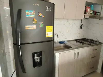a stainless steel refrigerator in a kitchen with a sink at Summer 811 in Cartagena de Indias