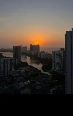 a sunset over a river in a city with buildings at Hermoso apto, cerca al mar in Cartagena de Indias