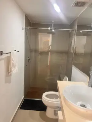 a bathroom with a shower and a toilet and a sink at Vista Lateral al Mar, ApartaEstudio , Cerca Hotel Hilton y Salida al Mar in Cartagena de Indias