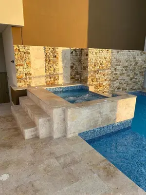 a bath tub in a room with tiles on the wall at Bocagrande Urban loft in Cartagena de Indias