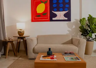 a living room with a couch and a coffee table at Apartamento Benitez 301 by Zakher in Cartagena de Indias