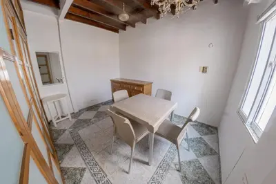 a dining room with a white table and chairs at Cozy apartment in the old city 421 in Cartagena de Indias