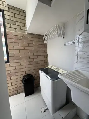 a white bathroom with a sink and a toilet at Espectacular Apartamento Amoblado - 2 Habitaciones in Barranquilla