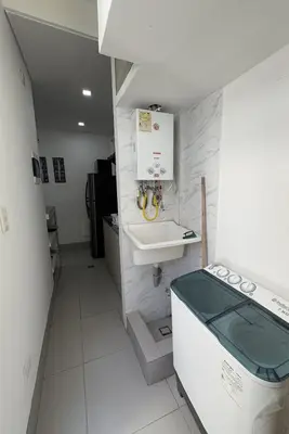 a small white bathroom with a sink and a counter at Espectacular Apartamento Amoblado - 2 Habitaciones in Barranquilla