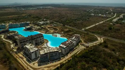 an aerial view of a building with blue water at Baia Kristal Cartagena in Cartagena de Indias