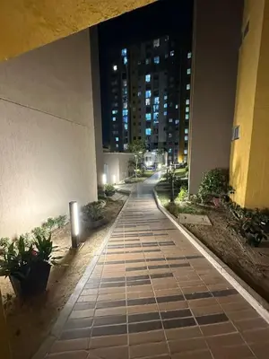 an empty sidewalk in a city at night at Cozy apartment in the heart of Barranquilla in Barranquilla