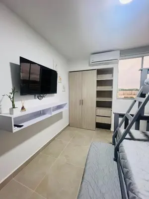a bedroom with a flat screen tv on a wall at Apartamento Descanso Cartagena in Manzanillo del Mar