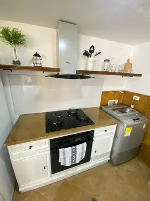 a kitchen with a stove and a counter top at Cabrero Beach 1008 in Cartagena de Indias